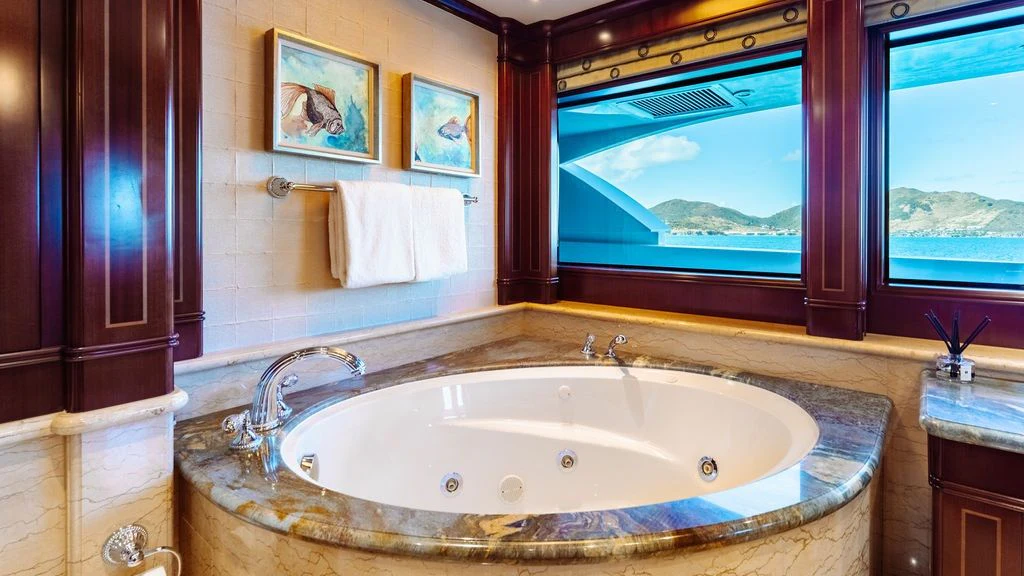 a large bathtub in a bathroom aboard LADY BETH Yacht for Sale