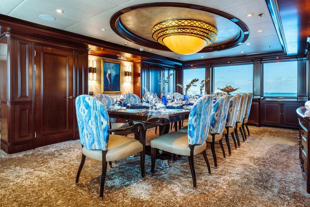 a dining room with a table and chairs aboard LADY BETH Yacht for Sale