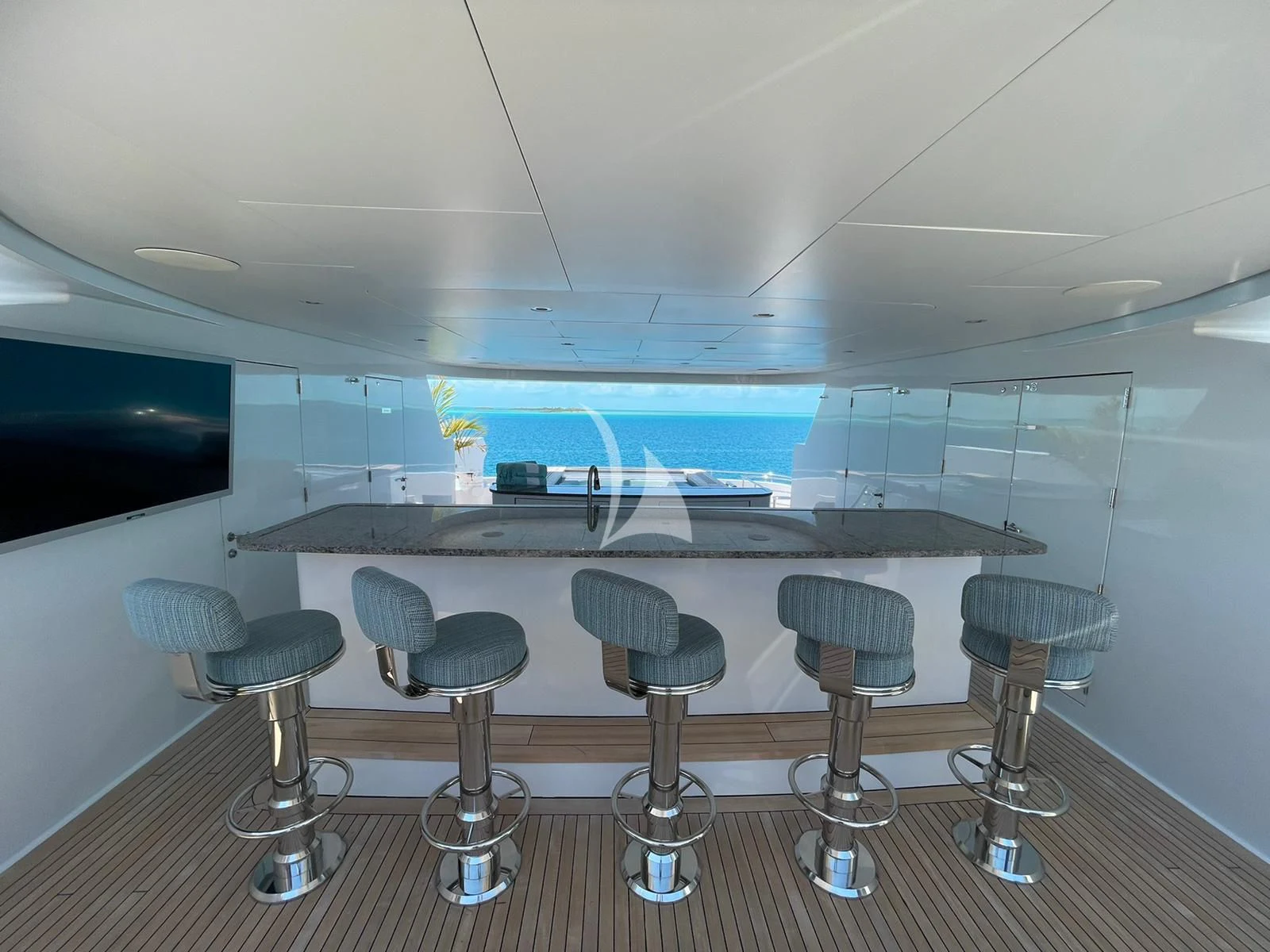a room with chairs and a table aboard LADY BETH Yacht for Sale