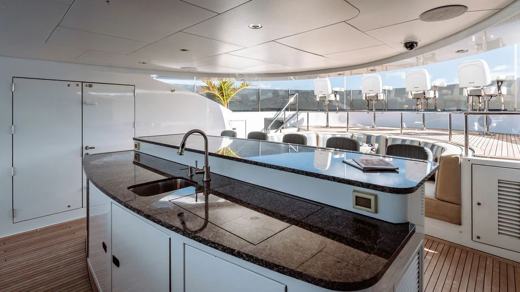a kitchen with a large island aboard LADY BETH Yacht for Sale