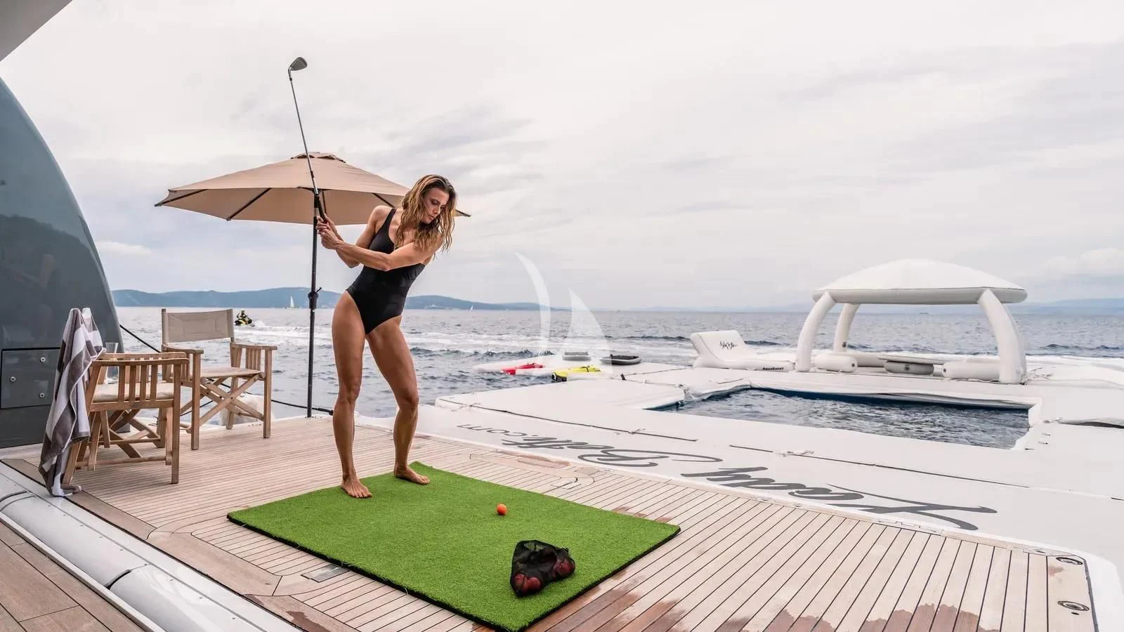 a person playing golf aboard LADY BETH Yacht for Sale