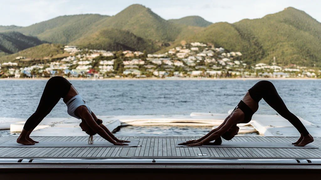 a person doing yoga on a dock aboard LADY BETH Yacht for Sale
