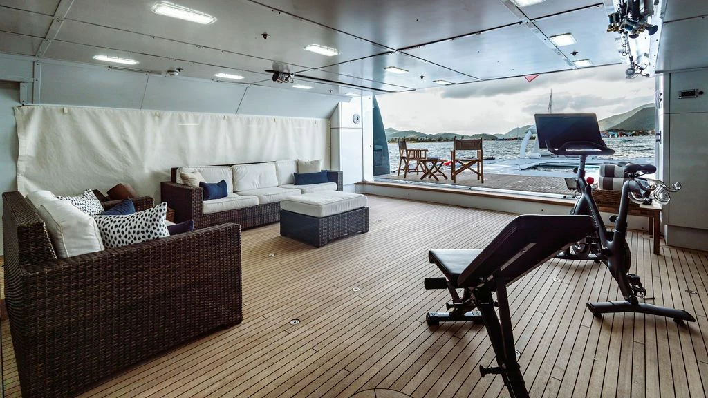 a room with a couch and a pool table aboard LADY BETH Yacht for Sale