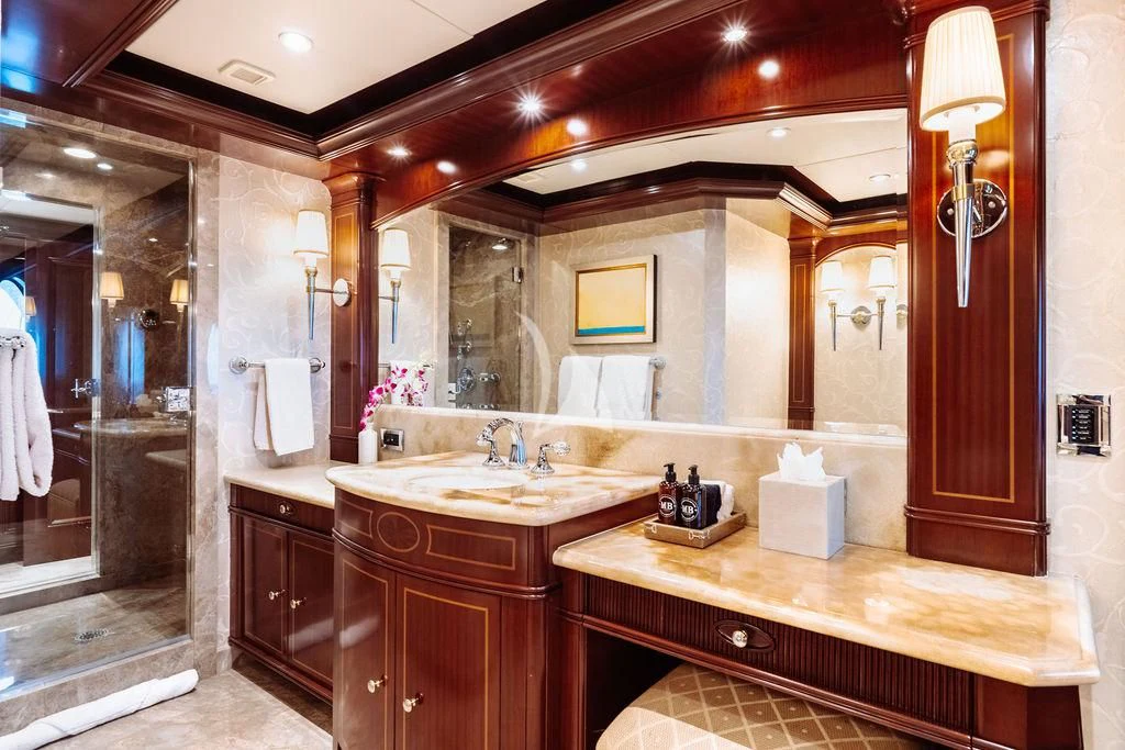 a bathroom with a large mirror aboard LADY BETH Yacht for Sale