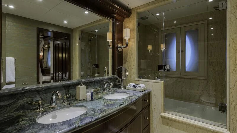a bathroom with a large mirror aboard LADY BETH Yacht for Sale