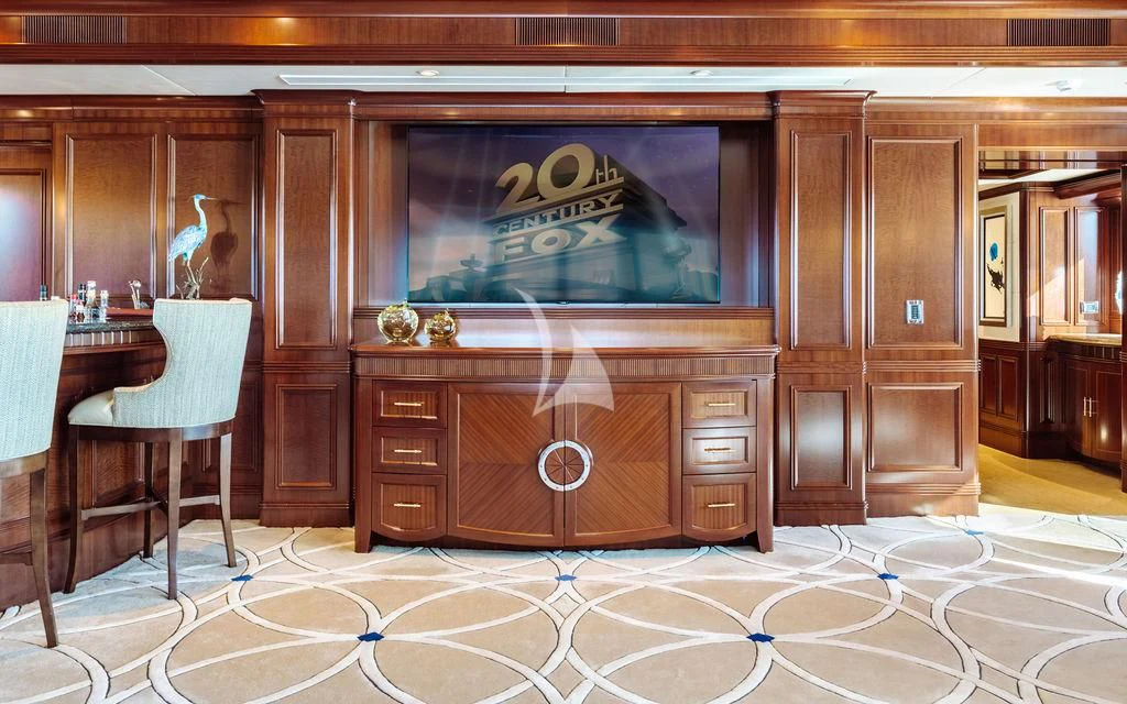 a room with a tv and chairs aboard LADY BETH Yacht for Sale