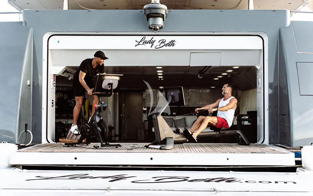 a man and a woman in a machine aboard LADY BETH Yacht for Sale