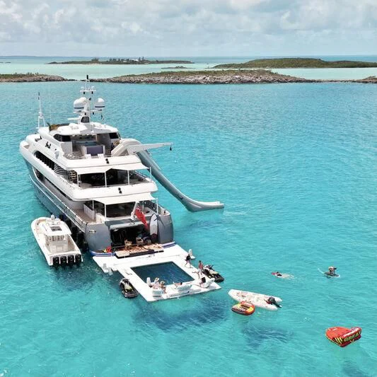 a helicopter flying over a boat in the water aboard LADY BETH Yacht for Sale