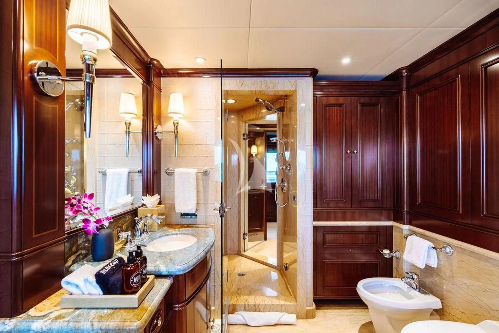 a bathroom with a sink and a mirror aboard LADY BETH Yacht for Sale