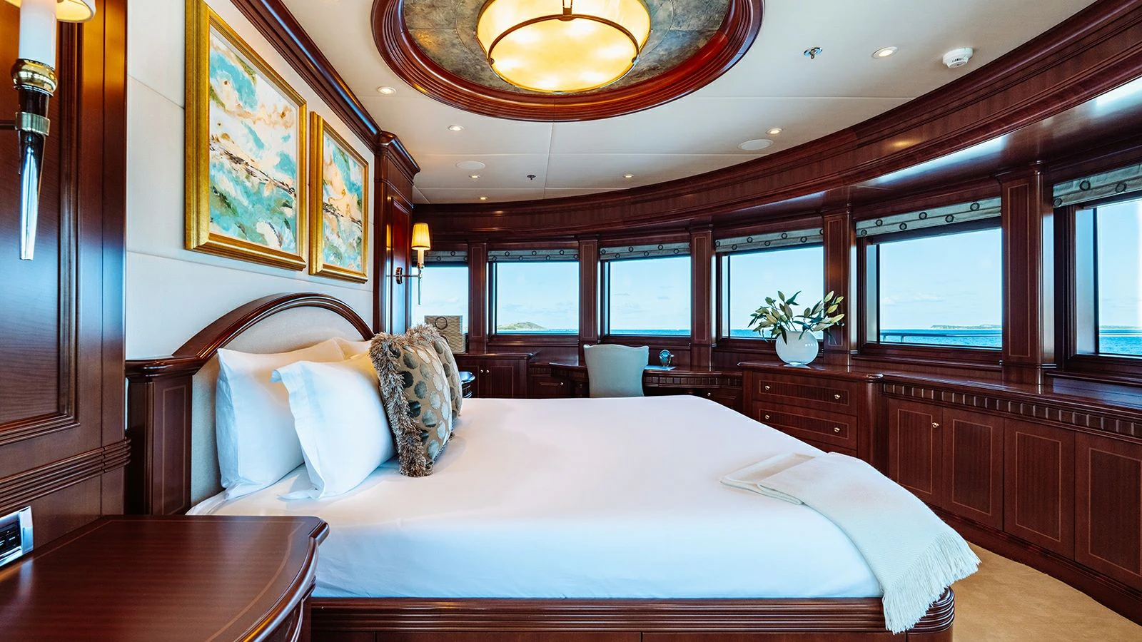 a room with a bed and a table aboard LADY BETH Yacht for Sale