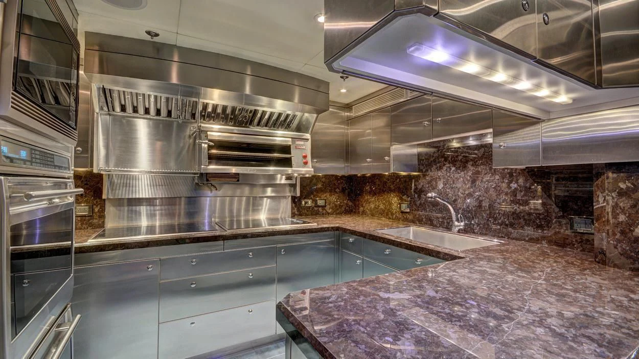 a large kitchen with stainless steel appliances aboard LADY BETH Yacht for Sale