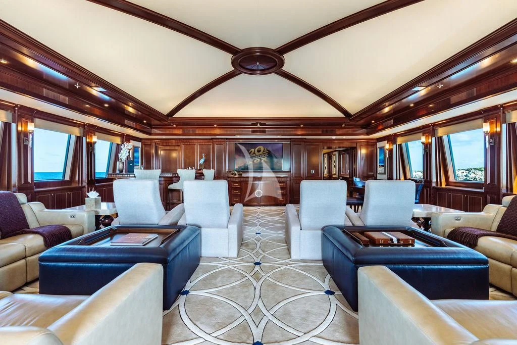 a large room with a large table and chairs aboard LADY BETH Yacht for Sale