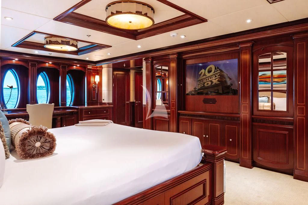 a room with a bed and a desk aboard LADY BETH Yacht for Sale