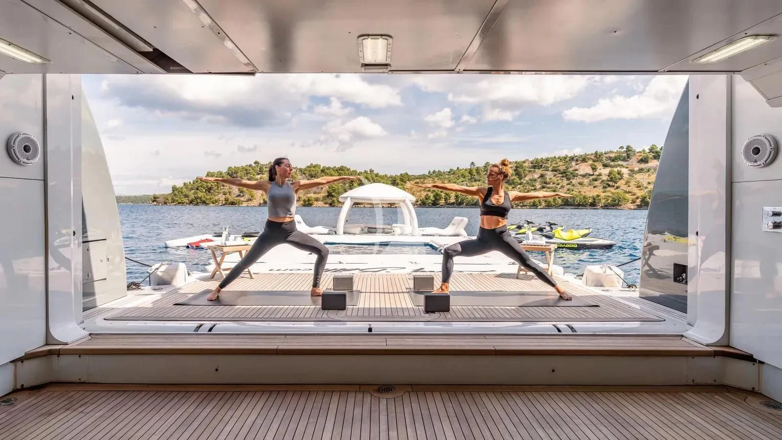 a couple of women running on a treadmill aboard LADY BETH Yacht for Sale
