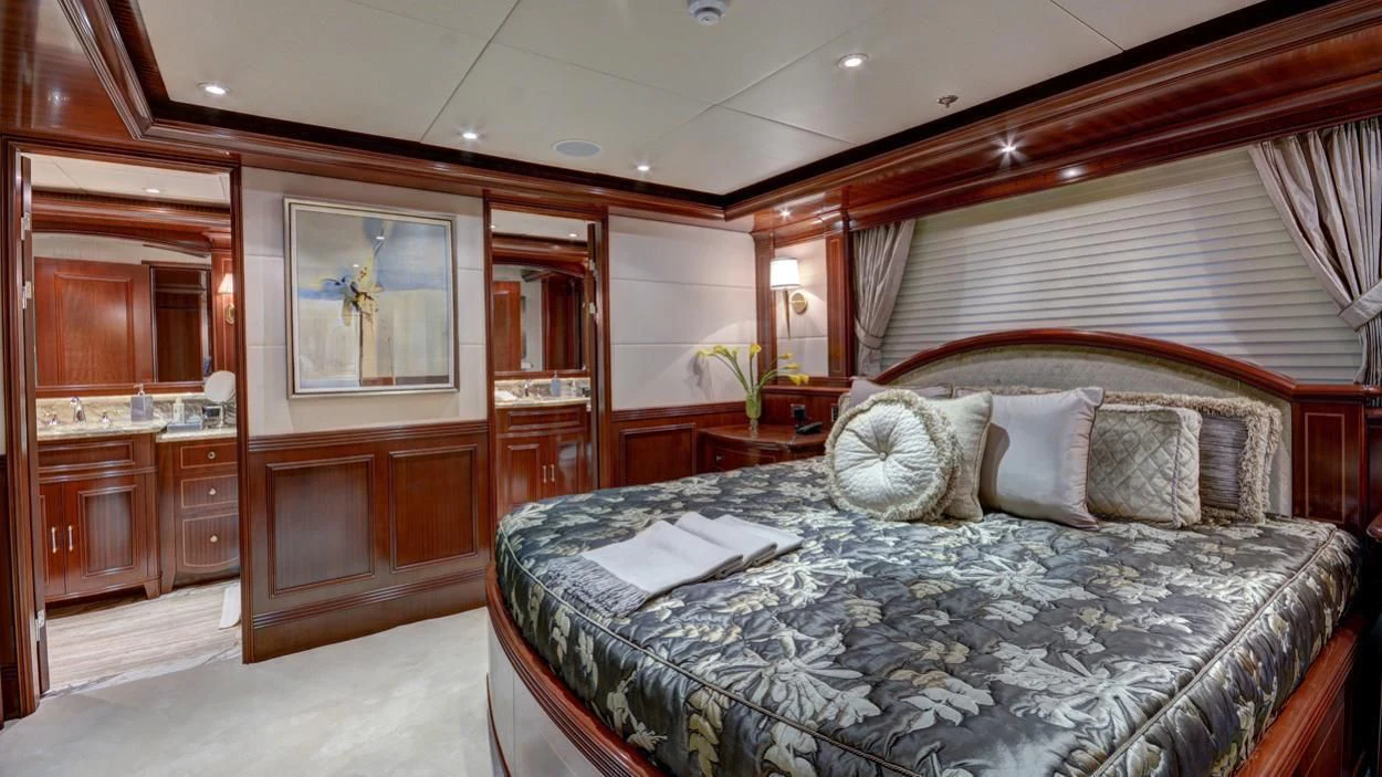 a large bedroom with a bed aboard LADY BETH Yacht for Sale