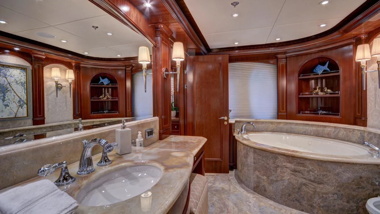 a bathroom with a large bathtub and a sink aboard LADY BETH Yacht for Sale