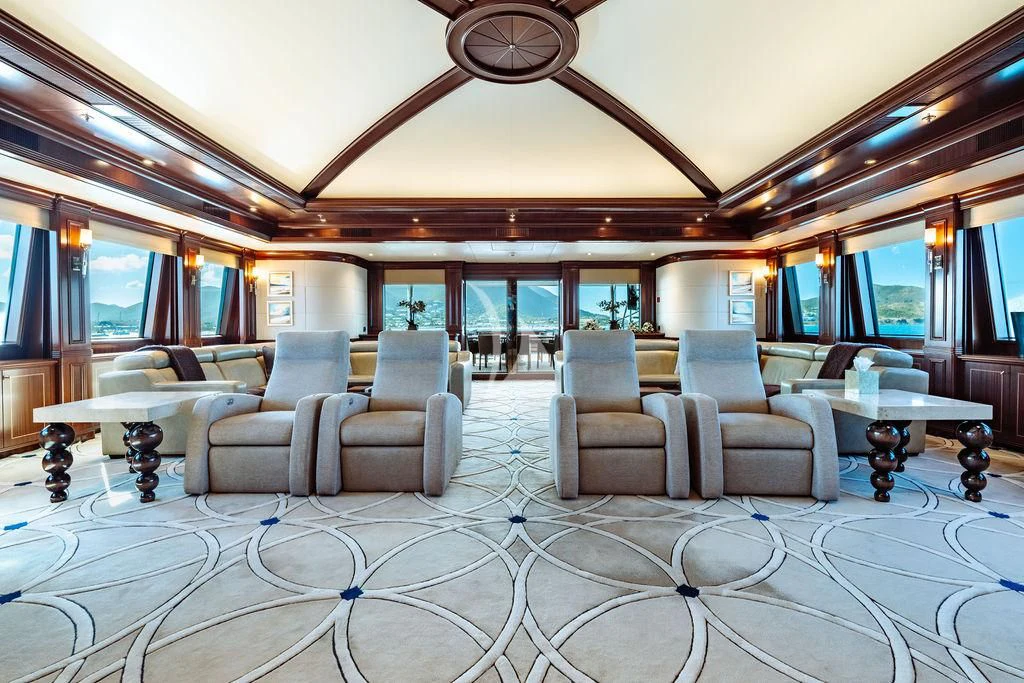 a large room with chairs and a table aboard LADY BETH Yacht for Sale