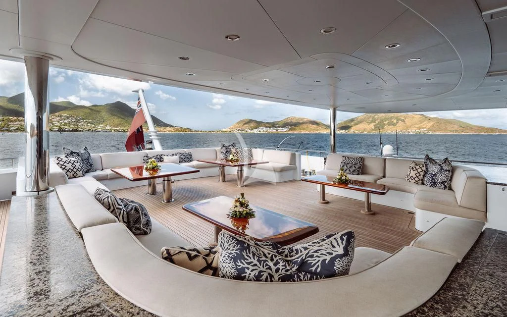 a living room with a large patio aboard LADY BETH Yacht for Sale
