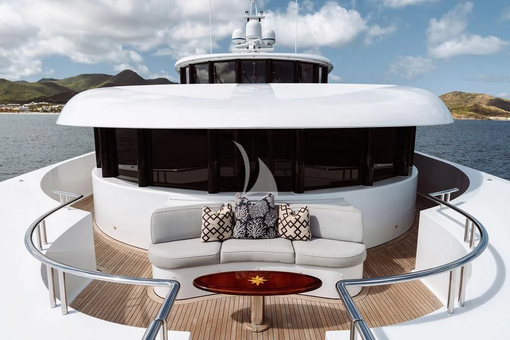 a white boat on a lake aboard LADY BETH Yacht for Sale