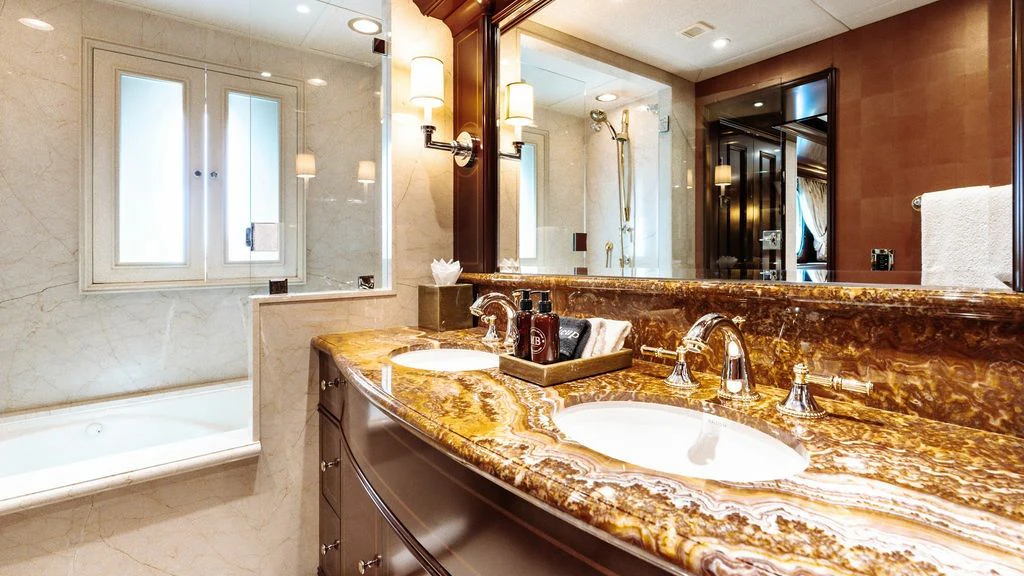 a bathroom with a large mirror aboard LADY BETH Yacht for Sale