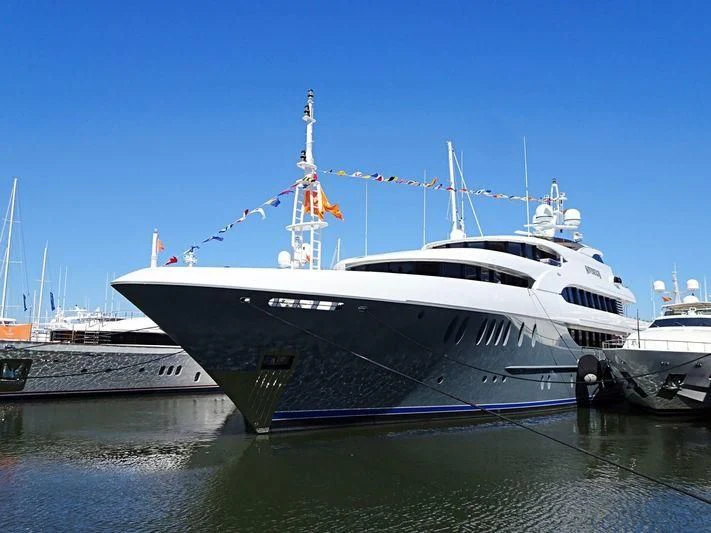 a large white boat with a crane on top aboard LADY BETH Yacht for Sale