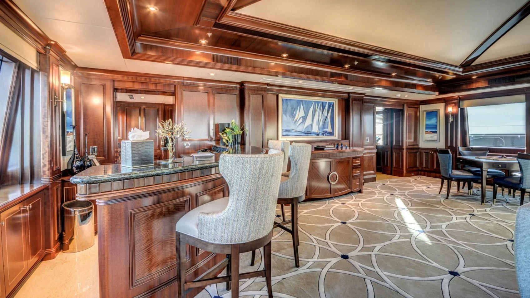 a room with a table chairs and a tv aboard LADY BETH Yacht for Sale