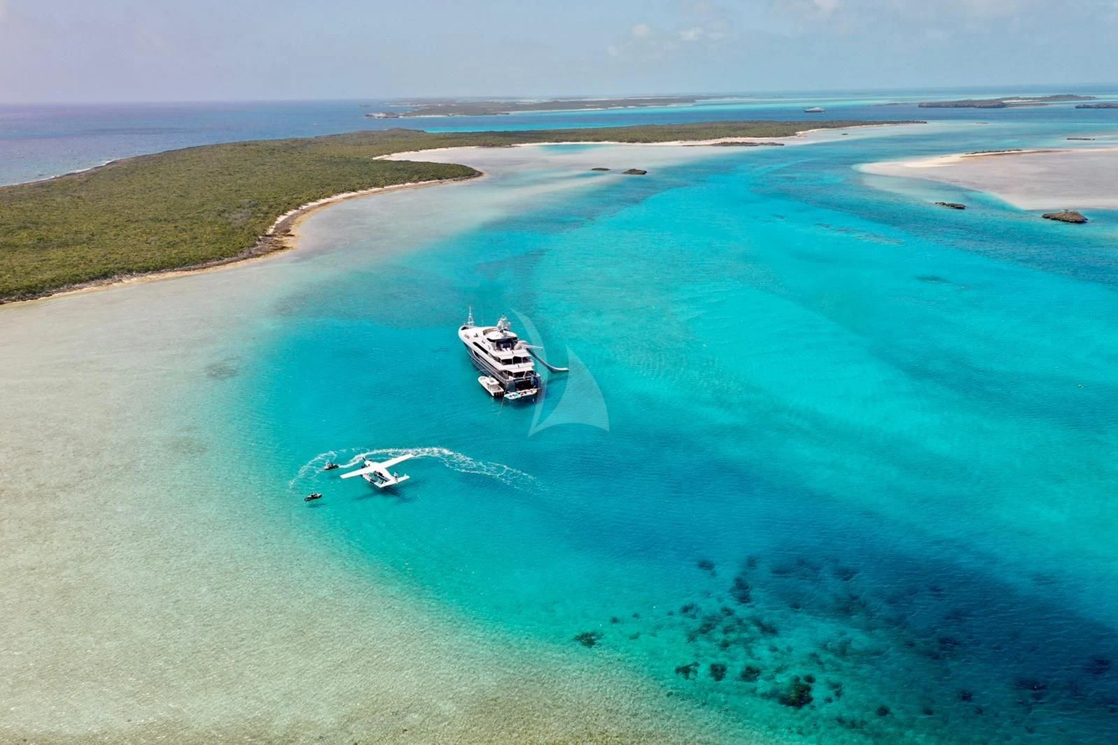 a helicopter flying over a beach aboard LADY BETH Yacht for Sale