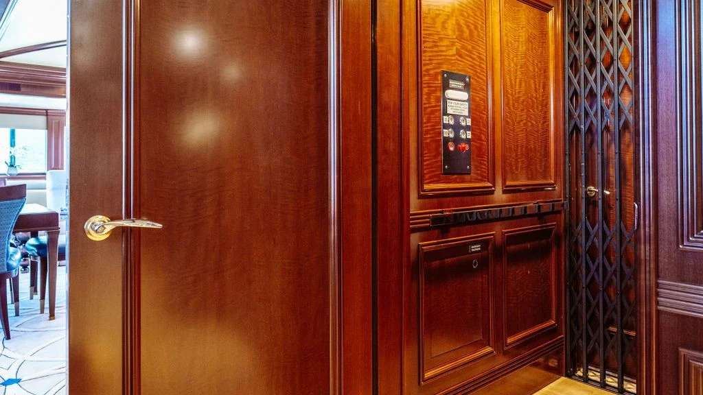 a room with wooden cabinets aboard LADY BETH Yacht for Sale