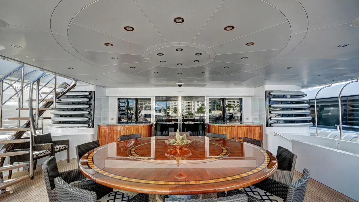 a large dining table in a room aboard LADY BETH Yacht for Sale
