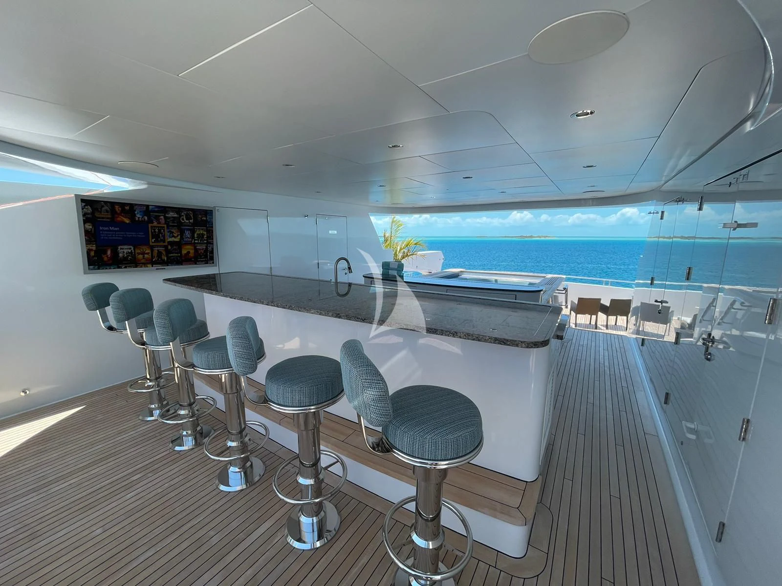 a room with chairs and tables aboard LADY BETH Yacht for Sale