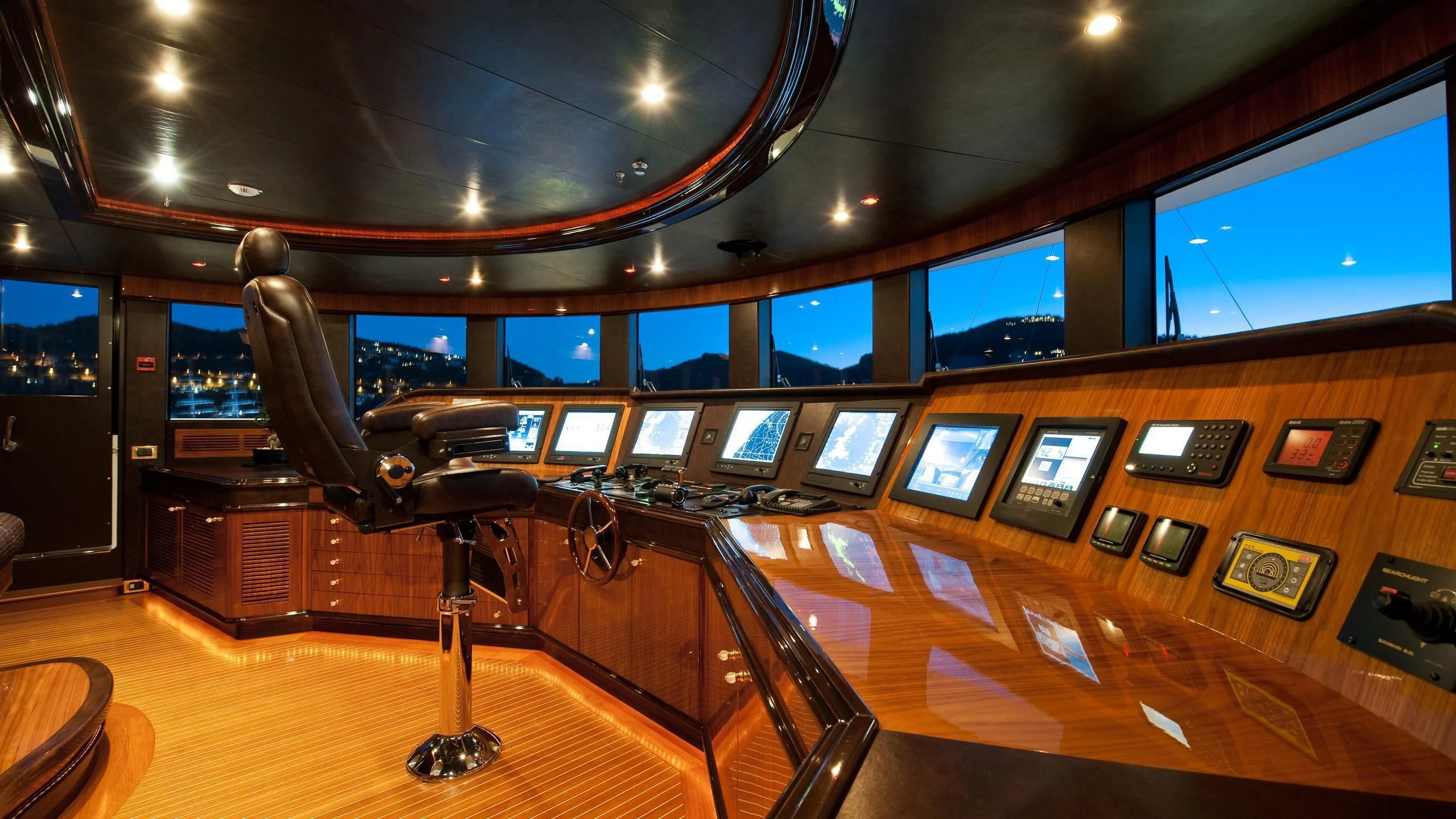 a room with a desk and chairs aboard DILARA Yacht for Sale