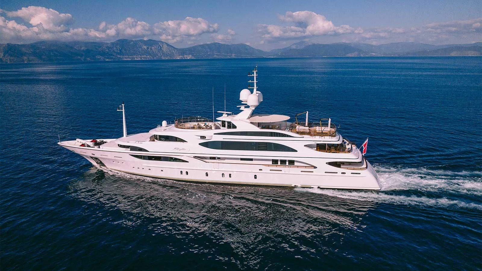 a white yacht in the water aboard DILARA Yacht for Sale