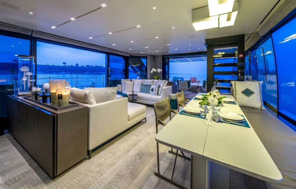 a room with a table and chairs aboard DILARA Yacht for Sale