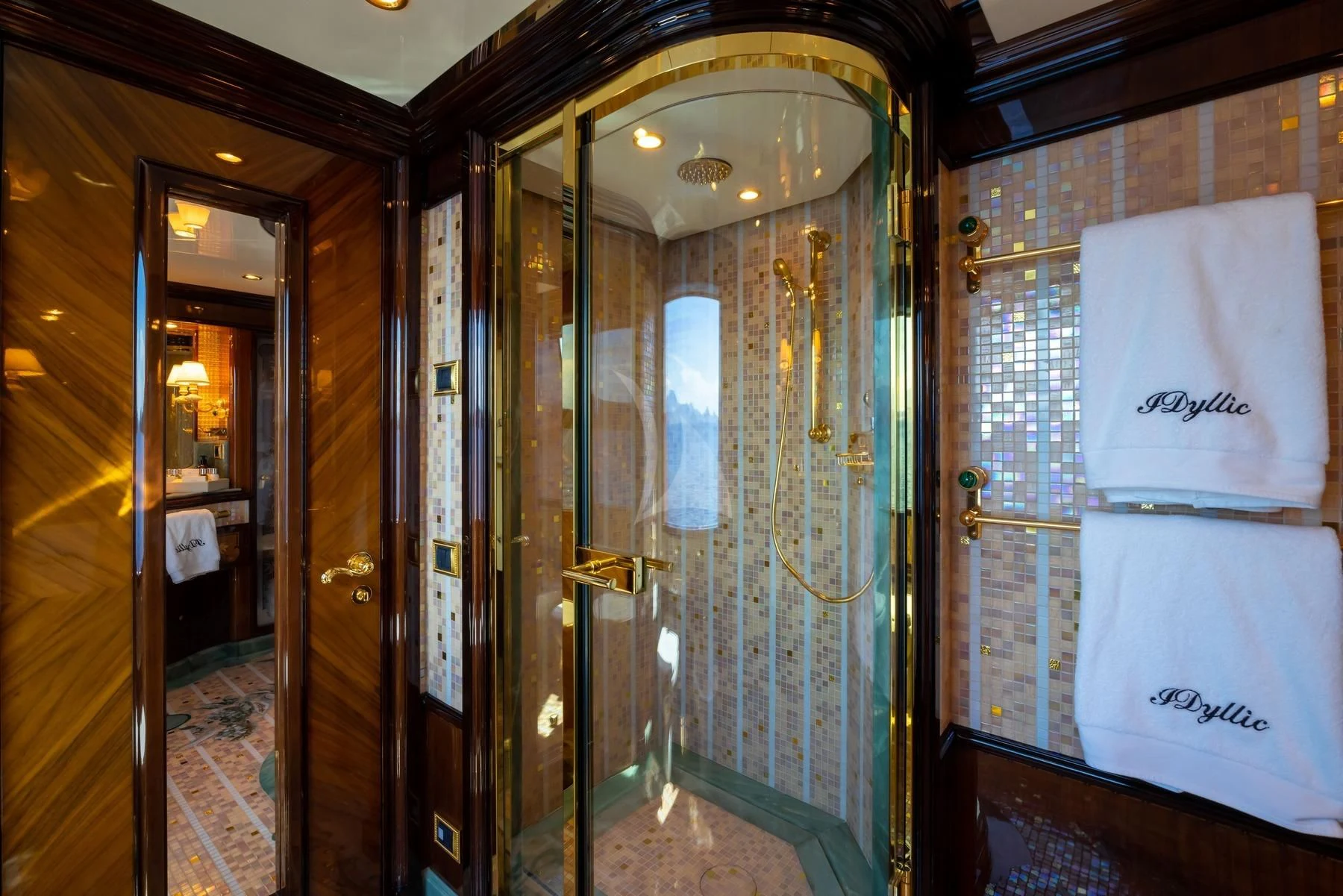 a bathroom with a glass shower aboard DILARA Yacht for Sale