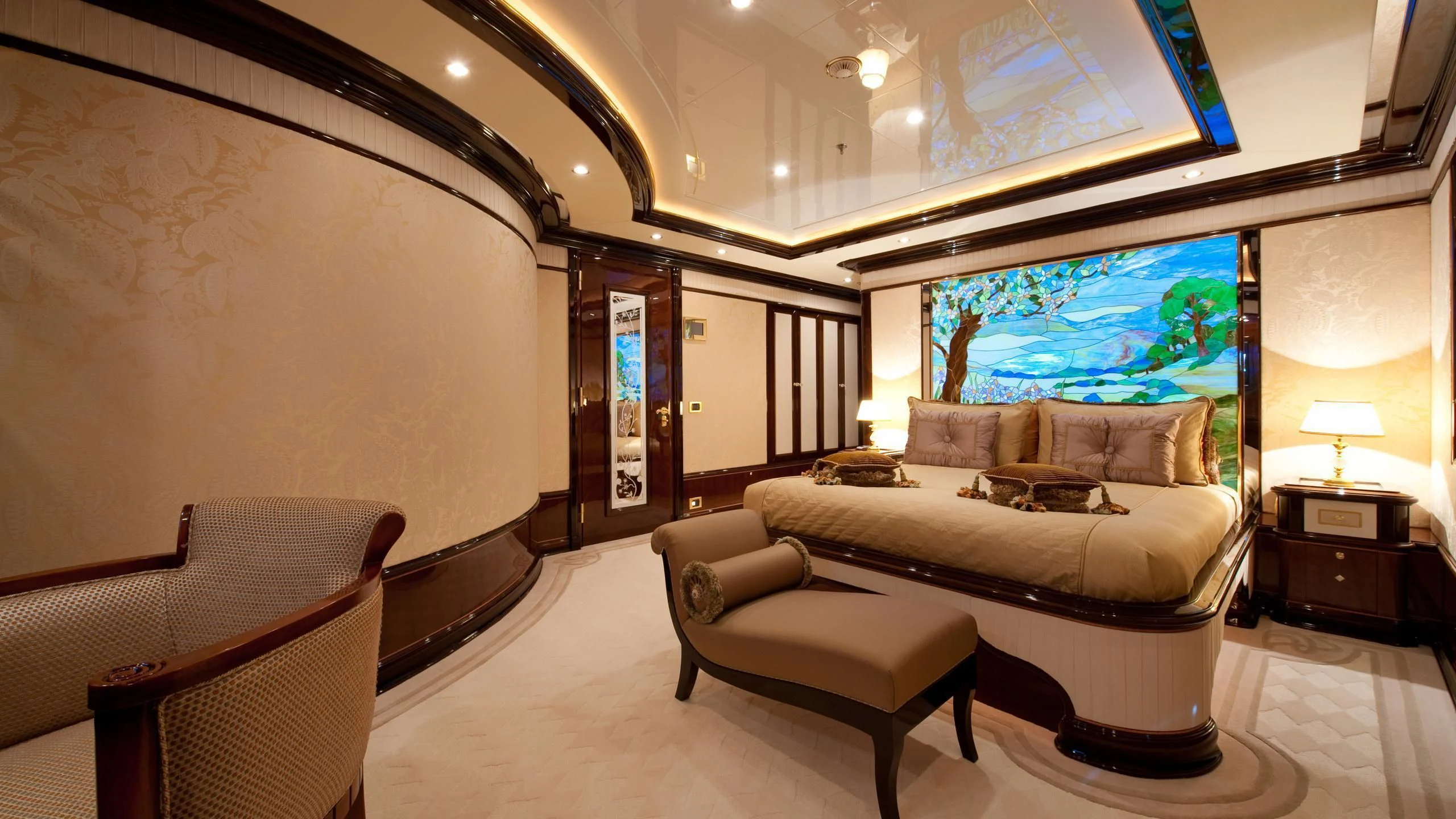 a large room with a bed and a tv aboard DILARA Yacht for Sale