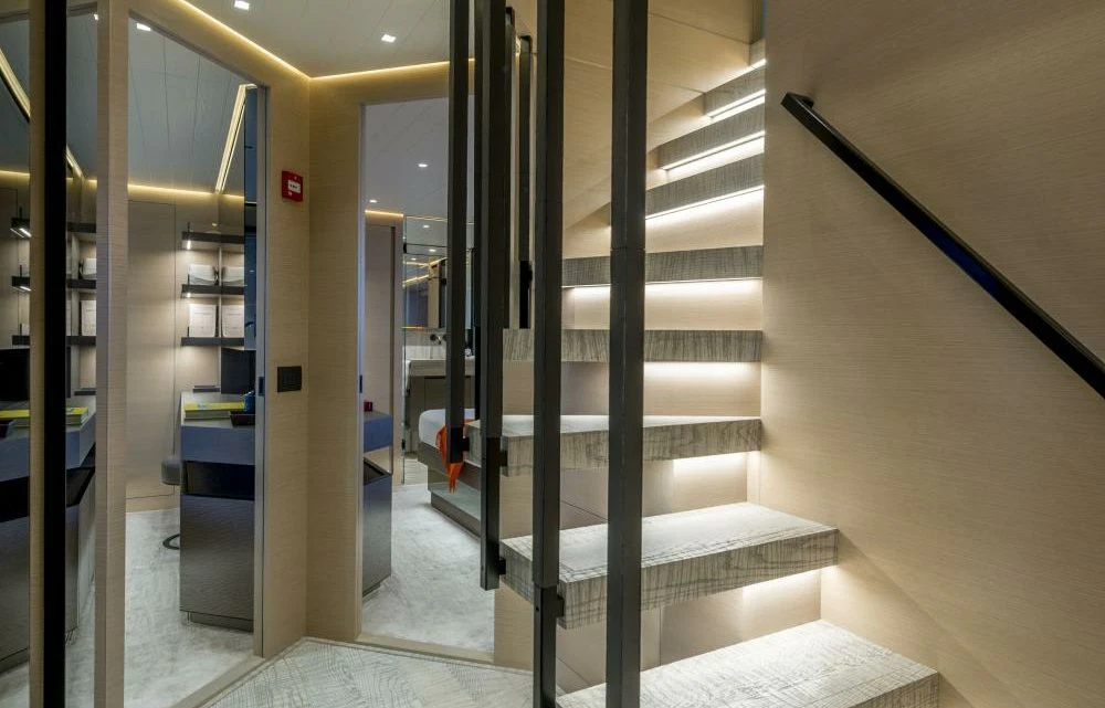 a hallway with glass doors aboard DILARA Yacht for Sale