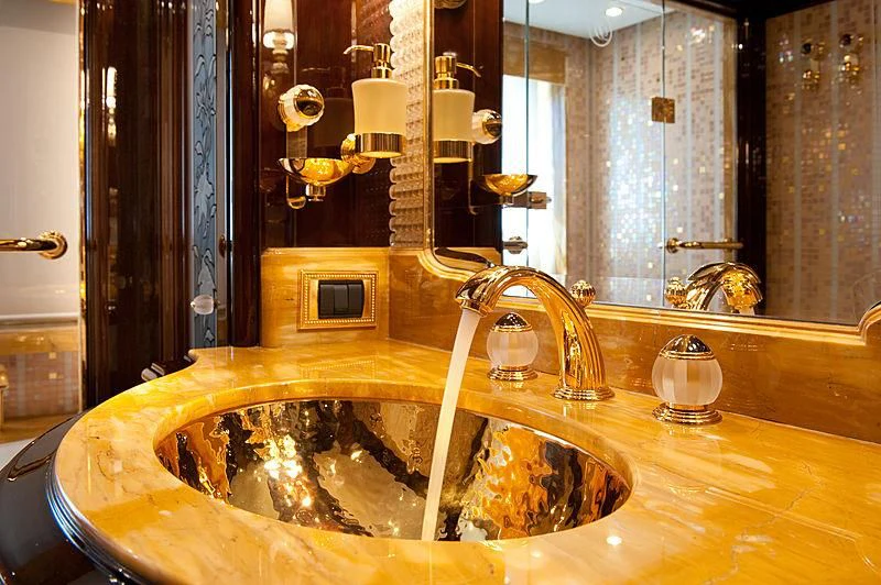 a bathroom with a sink and a large mirror aboard DILARA Yacht for Sale