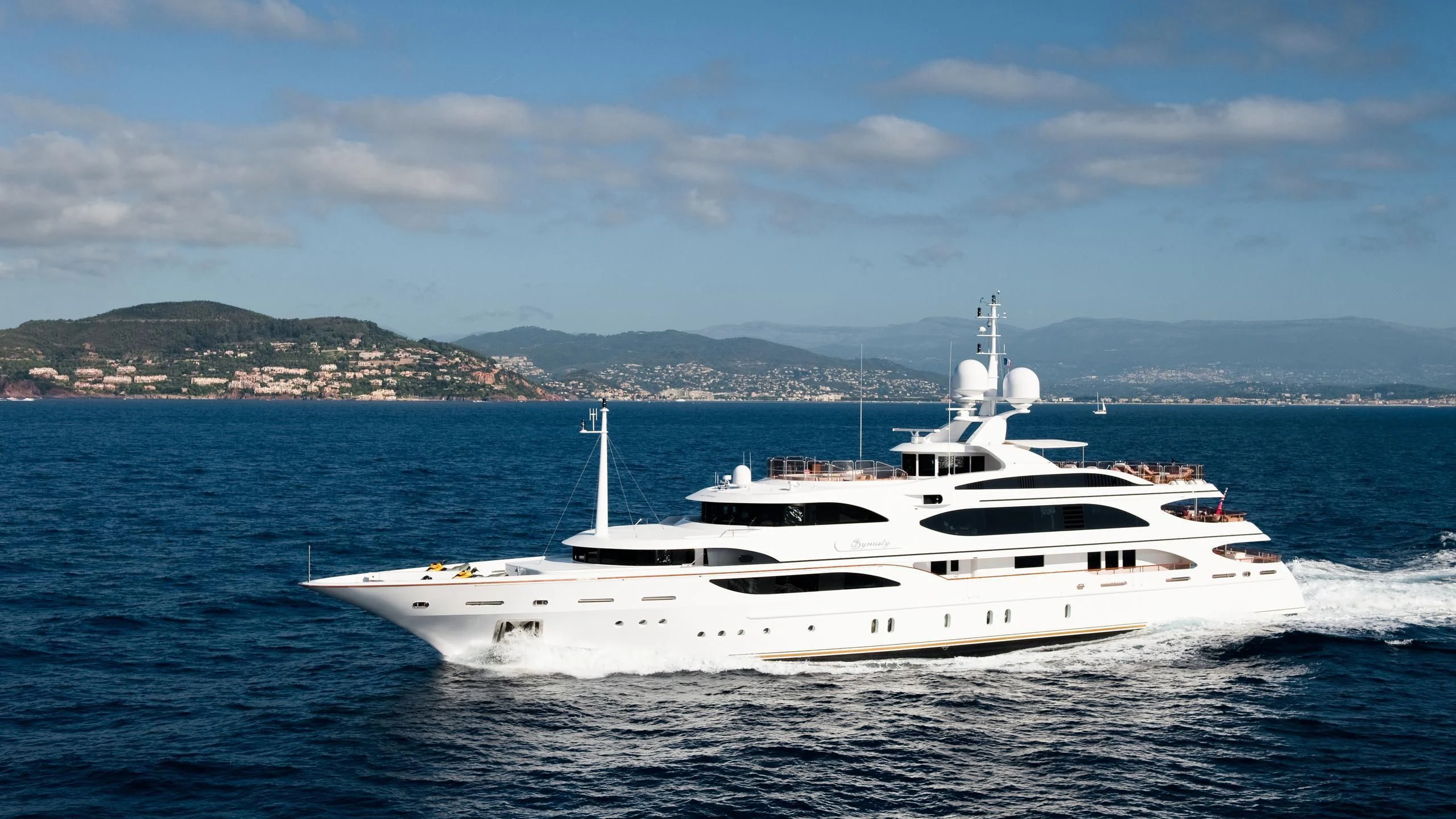 a white yacht on the water aboard DILARA Yacht for Sale