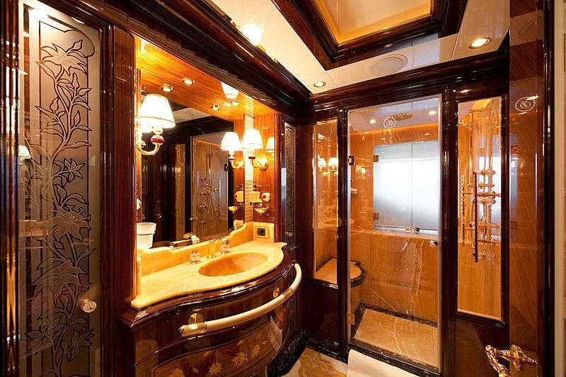 a bathroom with a large mirror aboard DILARA Yacht for Sale