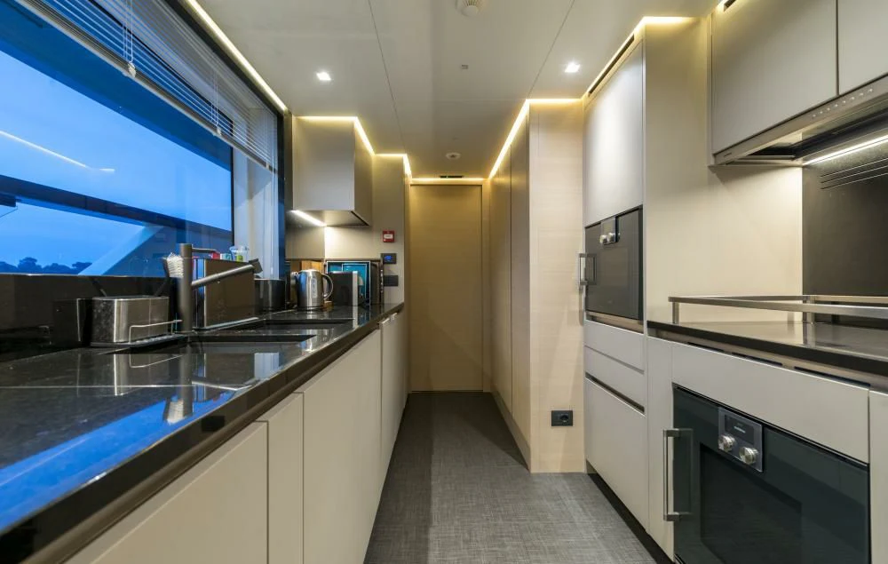 a kitchen with a large counter aboard DILARA Yacht for Sale