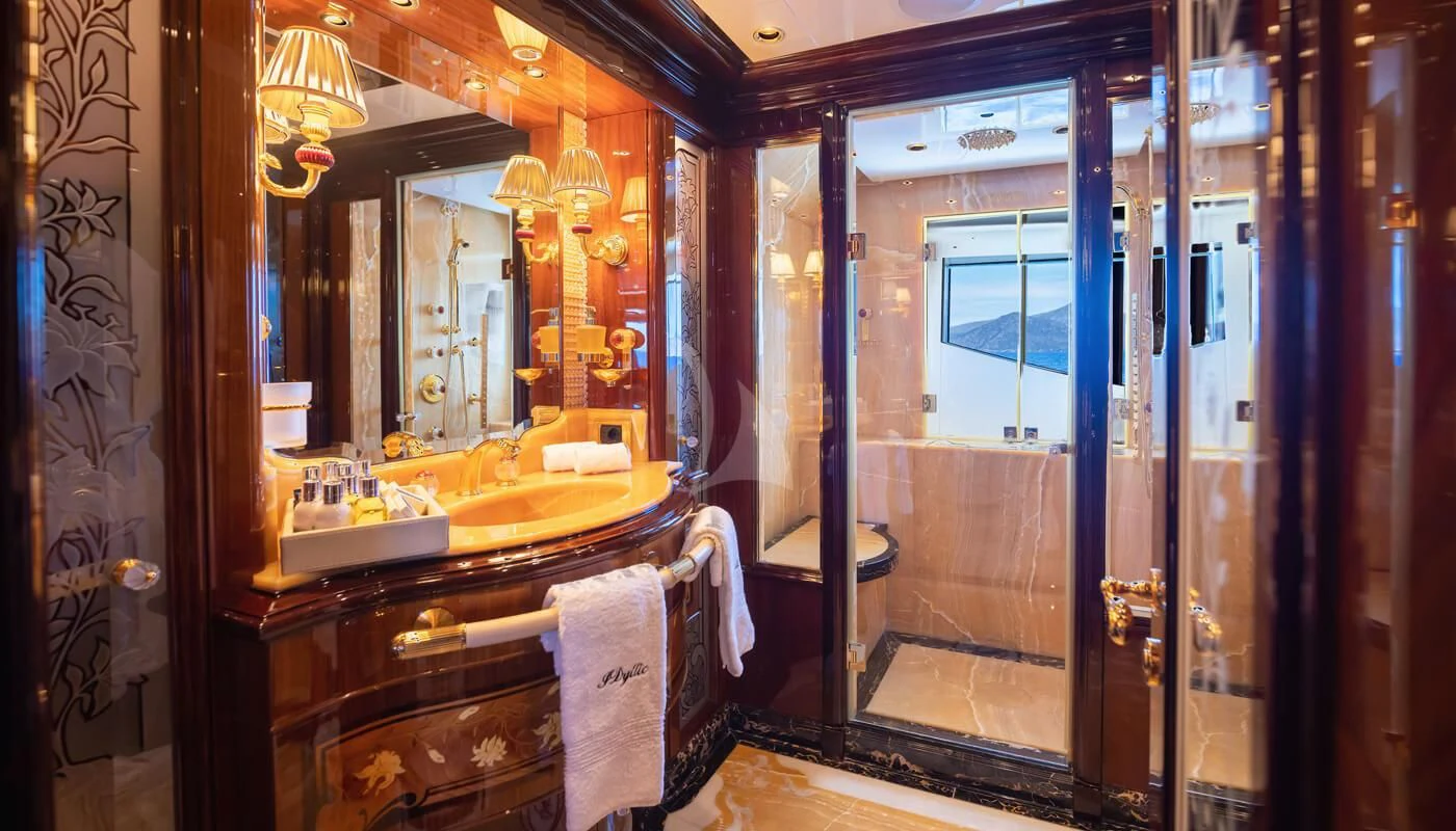 a bathroom with a large mirror aboard DILARA Yacht for Sale
