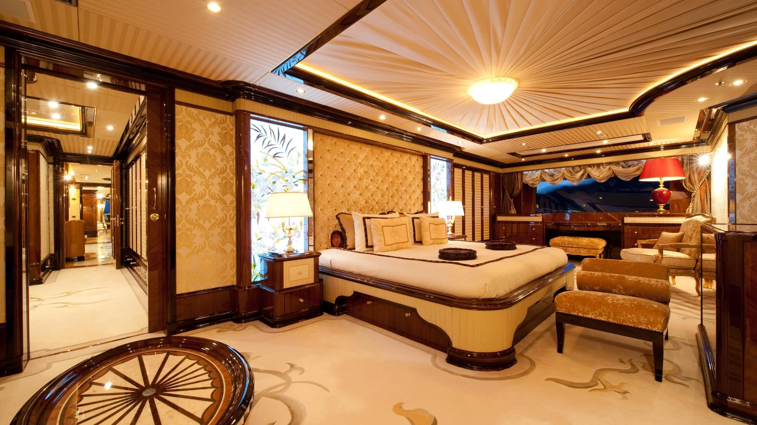 a large bedroom with a large bed aboard DILARA Yacht for Sale