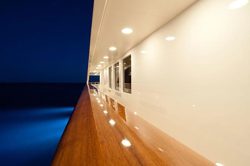 a room with a pool and a table with chairs and a table aboard DILARA Yacht for Sale