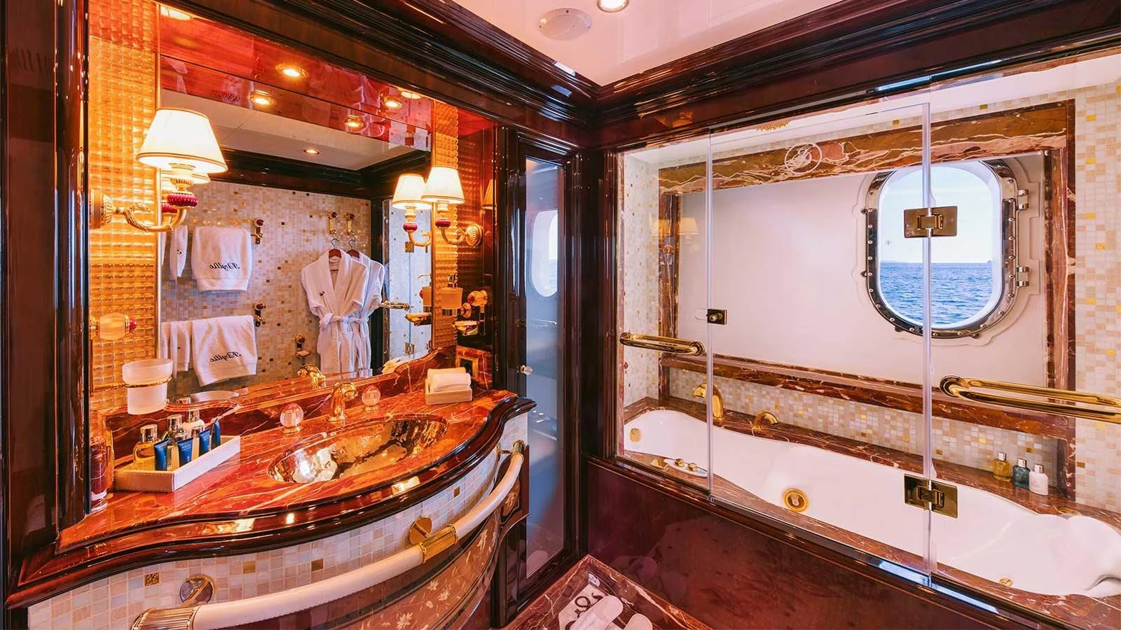 a bathroom with a large mirror aboard DILARA Yacht for Sale