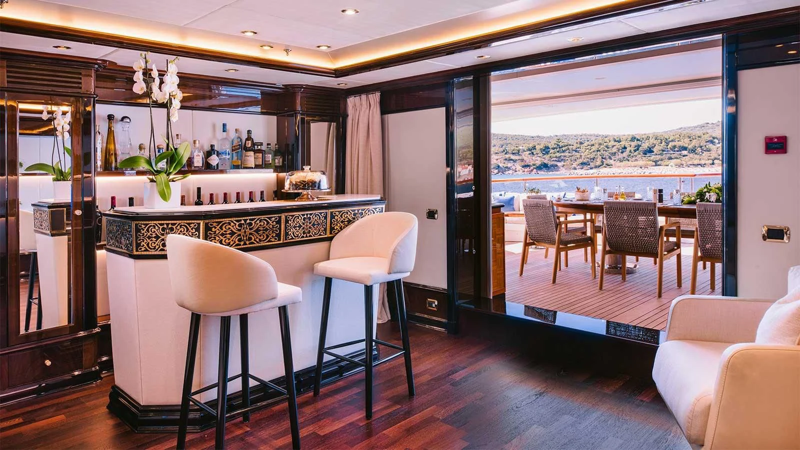 a bar with stools and stools aboard DILARA Yacht for Sale