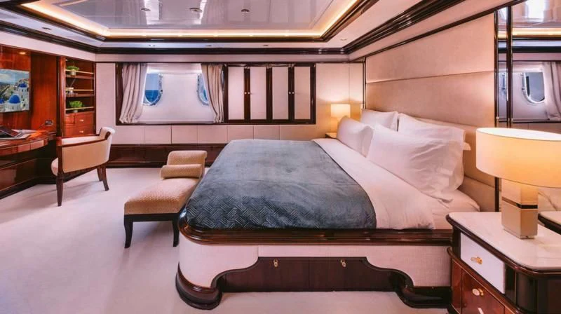 a bed in a room aboard DILARA Yacht for Sale
