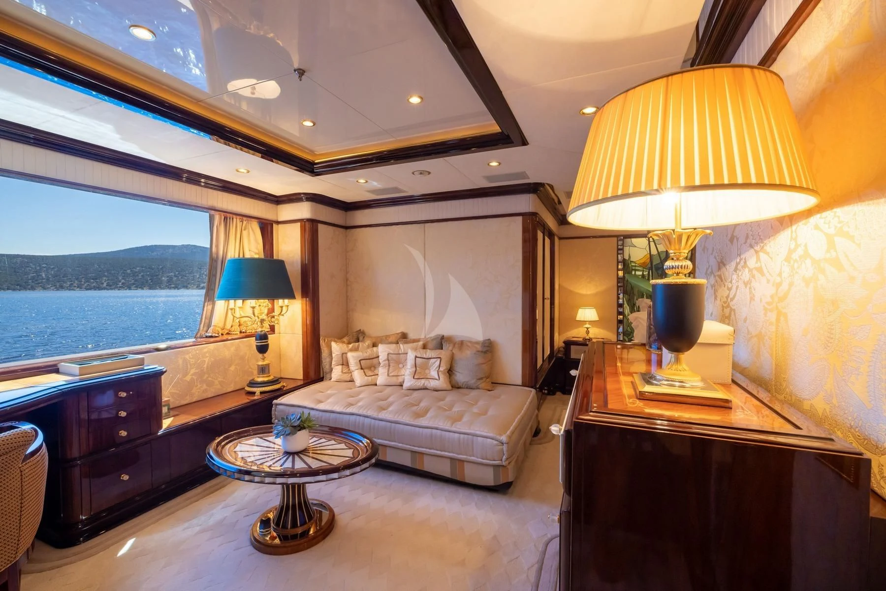 a large bedroom with a large bed aboard DILARA Yacht for Sale