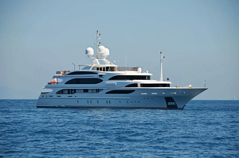 a white yacht in the water aboard DILARA Yacht for Sale