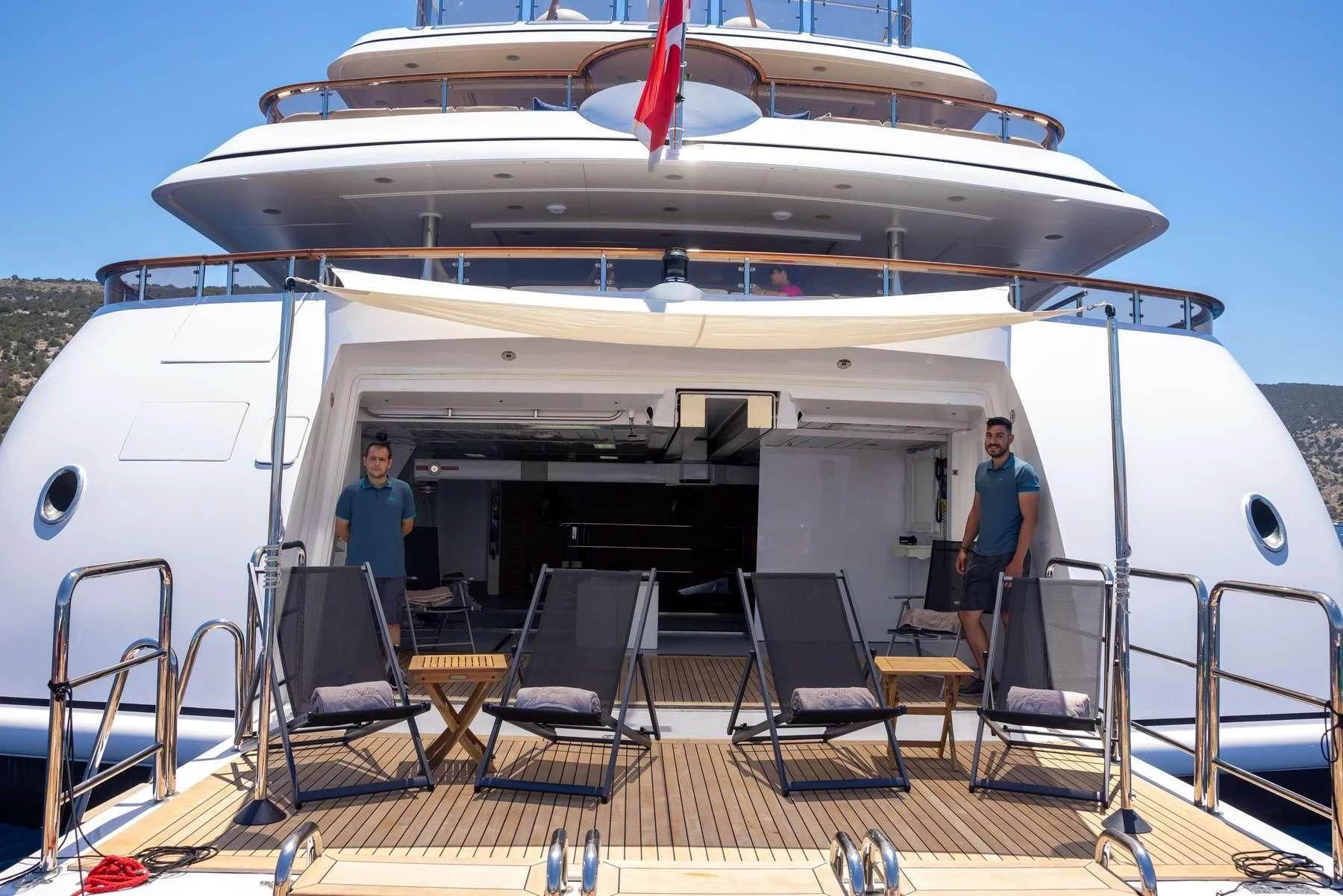 a couple of men standing on a boat aboard DILARA Yacht for Sale