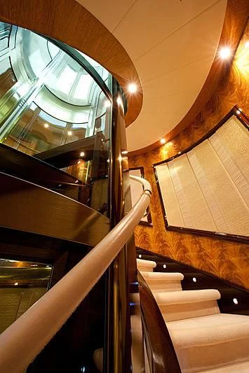 a staircase with a glass window aboard DILARA Yacht for Sale